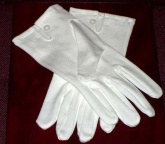 White cotton gloves with mother of pearl button wrist fastening and tri back stitching